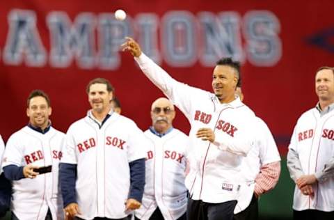 May 28, 2014; Boston, MA, USA; Boston Red Sox former player Manny Ramirez throws out the first pitch before the game against the Atlanta Braves at Fenway Park. Mandatory Credit: Greg M. Cooper-USA TODAY Sports