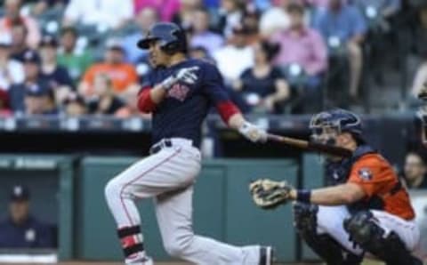 Apr 22, 2016; Houston, TX, USA; Boston Red Sox right fielder Mookie Betts (50) hits a triple during the first inning against the Houston Astros at Minute Maid Park. Mandatory Credit: Troy Taormina-USA TODAY Sports