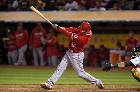 Apr 12, 2016; Oakland, CA, USA; Los Angeles Angels right fielder Daniel Nava (25) hits a single against the Oakland Athletics during the eighth inning at the Oakland Coliseum. Mandatory Credit: Kelley L Cox-USA TODAY Sports