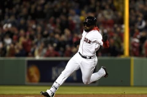 Apr 13, 2016; Boston, MA, USA; Boston Red Sox center fielder Jackie Bradley Jr. (25) touches second base on his way to third for a triple during the fourth inning against the Baltimore Orioles at Fenway Park. Mandatory Credit: Bob DeChiara-USA TODAY Sports