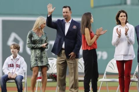 May 20, 2016; Boston, MA, USA; 2016 Red Sox Hall of Fame inductee Tim Wakefield waves to the crowd before throwing out the first pitch with fellow inductees Larry Lucchino and Jason Varitek (not pictured) before the start of the game against the Cleveland Indians at Fenway Park. Mandatory Credit: David Butler II-USA TODAY Sports