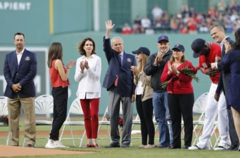 May 20, 2016; Boston, MA, USA; 2016 Red Sox Hall of Fame inductee Larry Lucchino waves to the crowd before throwing out the first pitch with fellow inductees Jason Varitek and Tim Wakefield (not pictured) before the start of the game against the Cleveland Indians at Fenway Park. Mandatory Credit: David Butler II-USA TODAY Sports