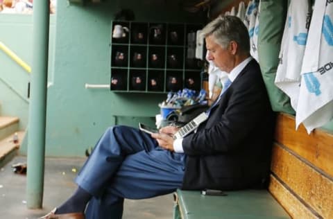 Jul 26, 2015; Boston, MA, USA; Detroit Tigers President, CEO and General Manager Dave Dombrowski works in the dugout before their game against the Boston Red Sox at Fenway Park. Mandatory Credit: Winslow Townson-USA TODAY Sports