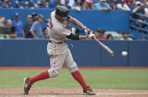 May 29, 2016; Toronto, Ontario, CAN; Boston Red Sox shortstop Xander Bogaerts (2) hits an RBI out during the eleventh inning in a game against the Toronto Blue Jays at Rogers Centre. The Red Sox won 5-3. Mandatory Credit: Nick Turchiaro-USA TODAY Sports