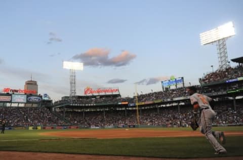 Jun 14, 2016; Boston, MA, USA; Baltimore Orioles center fielder Adam Jones (10) takes the field during the fifth inning against the Boston Red Sox at Fenway Park. Mandatory Credit: Bob DeChiara-USA TODAY Sports