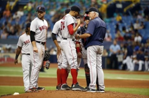 Jun 29, 2016; St. Petersburg, FL, USA; Boston Red Sox starting pitcher David Price (24) talks with pitching coach Carl Willis (54) during the sixth inning against the Tampa Bay Rays at Tropicana Field. Tampa Bay Rays defeated the Boston Red Sox 4-0. Mandatory Credit: Kim Klement-USA TODAY Sports