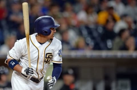 Jun 14, 2016; San Diego, CA, USA; San Diego Padres center fielder Jon Jay (24) doubles during the third inning against the Miami Marlins at Petco Park. Mandatory Credit: Jake Roth-USA TODAY Sports