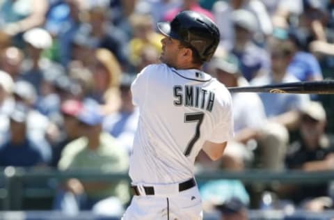 May 31, 2016; Seattle, WA, USA; Seattle Mariners left fielder Seth Smith (7) hits a three-run home run against the San Diego Padres during the third inning at Safeco Field. Mandatory Credit: Joe Nicholson-USA TODAY Sports