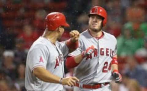 Jul 1, 2016; Boston, MA, USA; Los Angeles Angels first baseman C.J. Cron (24) celebrates his grand slam with designated hitter Albert Pujols (left) at Fenway Park. Mandatory Credit: Mark L. Baer-USA TODAY Sports