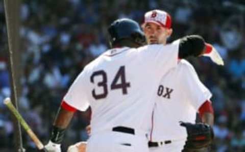 Jul 4, 2016; Boston, MA, USA; Boston Red Sox starting pitcher Rick Porcello (22) is congratulated by designated hitter David Ortiz (34) at Fenway Park. Mandatory Credit: Winslow Townson-USA TODAY Sports