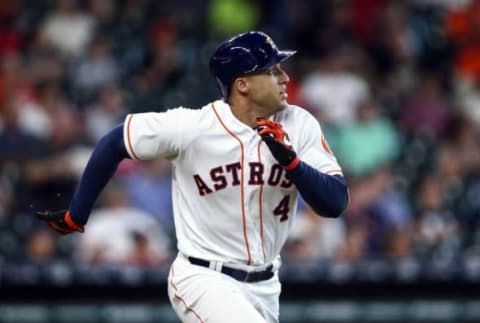 Jul 7, 2016; Houston, TX, USA; Houston Astros right fielder George Springer (4) hits a triple during the first inning against the Oakland Athletics at Minute Maid Park. Mandatory Credit: Troy Taormina-USA TODAY Sports