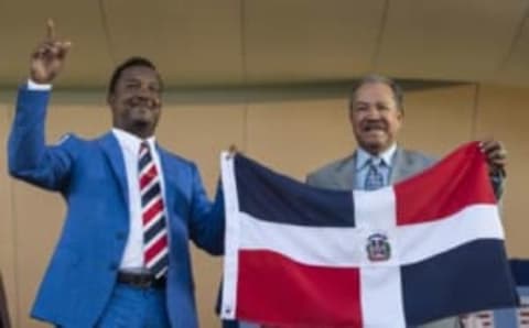 Jul 26, 2015; Cooperstown, NY, USA; Hall of Fame Inductee Pedro Martinez (L) and Hall of Famer Juan Marichal (R) hold up the Dominican Republic flat at the end of his acceptance speech during the Hall of Fame Induction Ceremonies at Clark Sports Center. Mandatory Credit: Gregory J. Fisher-USA TODAY Sports