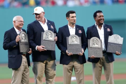 Aug 14, 2014; Boston, MA, USA; Boston Red Sox Hall of Fame Class of 2014, Joseph John Castiglione (left), Roger Clemens, Nomar Garciaparra and Pedro Martinez hold inductee plaques before the game against the Houston Astros at Fenway Park. Mandatory Credit: Greg M. Cooper-USA TODAY Sports