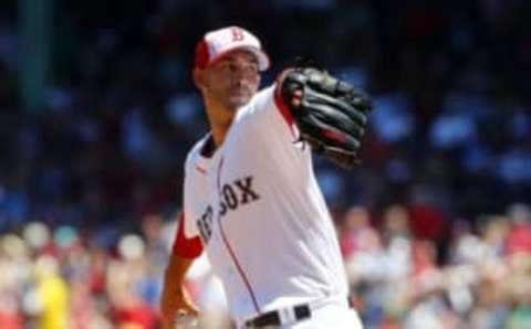 Jul 4, 2016; Boston, MA, USA; Boston Red Sox starting pitcher Rick Porcello (22) delivers against the Texas Rangers during the first inning at Fenway Park. Mandatory Credit: Winslow Townson-USA TODAY Sports