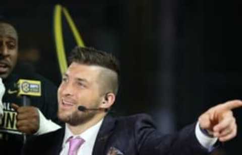 Jan 11, 2016; Glendale, AZ, USA; Former quarterback Tim Tebow works as a television analyst during the Clemson Tigers game against the Alabama Crimson Tide in the 2016 CFP National Championship at University of Phoenix Stadium. Mandatory Credit: Mark J. Rebilas-USA TODAY Sports