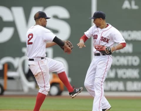 Jul 10, 2016; Boston, MA, USA; Boston Red Sox shortstop Xander Bogaerts (2) reacts with right fielder Mookie Betts (50) after defeating the Tampa Bay Rays at Fenway Park. Mandatory Credit: Bob DeChiara-USA TODAY Sports