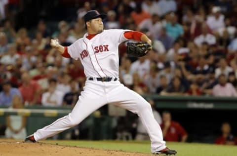 Jul 26, 2016; Boston, MA, USA; Boston Red Sox relief pitcher Junichi Tazawa (36) throws a pitch against the Detroit Tigers in the eighth inning at Fenway Park. Mandatory Credit: David Butler II-USA TODAY Sports