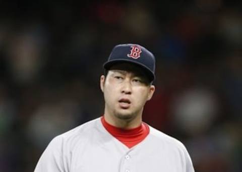 Aug 1, 2016; Seattle, WA, USA; Boston Red Sox relief pitcher Junichi Tazawa (36) walks back to the dugout following the final out of the eighth inning against the Seattle Mariners at Safeco Field. Boston defeated Seattle, 2-1. Mandatory Credit: Joe Nicholson-USA TODAY Sports