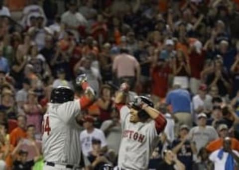 Aug 16, 2016; Baltimore, MD, USA; Boston Red Sox right fielder Mookie Betts (50) and designated hitter David Ortiz (34) celebrate at Oriole Park at Camden Yards. Mandatory Credit: Tommy Gilligan-USA TODAY Sports