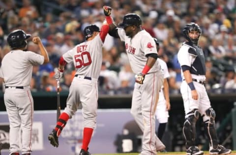 Aug 20, 2016; Detroit, MI, USA; Boston Red Sox designated hitter David Ortiz (34) celebrates with right fielder Mookie Betts (50) during the fifth inning against the Detroit Tigers at Comerica Park. Mandatory Credit: Raj Mehta-USA TODAY Sports