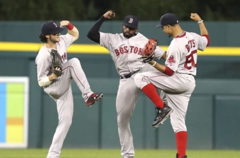 Aug 20, 2016; Detroit, MI, USA; Boston Red Sox left fielder Andrew Benintendi (left) center fielder Jackie Bradley Jr. (center) and right fielder Mookie Betts (right) celebrate after the game against the Detroit Tigers at Comerica Park. Red Sox win 3-2. Mandatory Credit: Raj Mehta-USA TODAY Sports