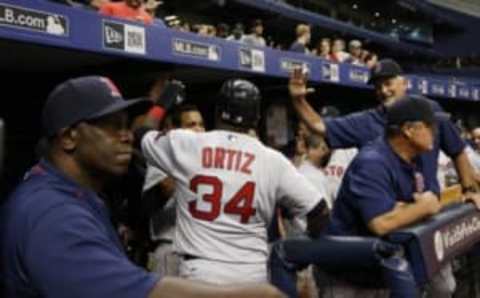 Aug 23, 2016; St. Petersburg, FL, USA; Boston Red Sox designated hitter David Ortiz (34) is congratulated in the dugout at Tropicana Field. Mandatory Credit: Kim Klement-USA TODAY Sports