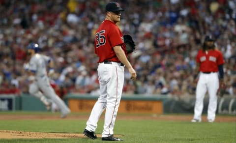 Aug 26, 2016; Boston, MA, USA; Boston Red Sox starting pitcher Steven Wright (35) reacts as Kansas City Royals left fielder Alex Gordon (4) runs the bases after hitting a two run homer in the first inning at Fenway Park. Mandatory Credit: David Butler II-USA TODAY Sports