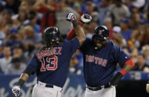 Sep 9, 2016; Toronto, Ontario, CAN; Boston Red Sox designated hitter David Ortiz (34) congratulates first baseman Hanley Ramirez (13) at Rogers Centre. Mandatory Credit: John E. Sokolowski-USA TODAY Sports