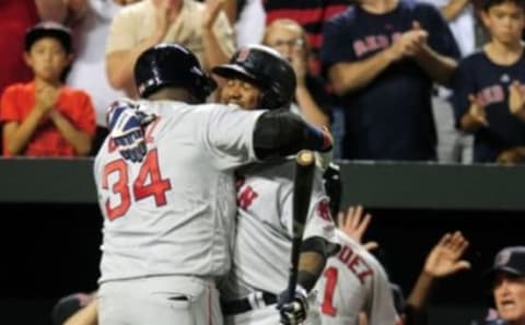 Sep 20, 2016; Baltimore, MD, USA; Boston Red Sox designated hitter David Ortiz (34) is congratulated by first baseman Hanley Ramirez (13) after hitting a home run in the seventh inning against the Baltimore Orioles at Oriole Park at Camden Yards. Mandatory Credit: Evan Habeeb-USA TODAY Sports