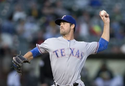 Sep 23, 2016; Oakland, CA, USA; Texas Rangers starting pitcher Cole Hamels (35) delivers a pitch against the Oakland Athletics during the first inning at Oakland Coliseum. Mandatory Credit: Neville E. Guard-USA TODAY Sports