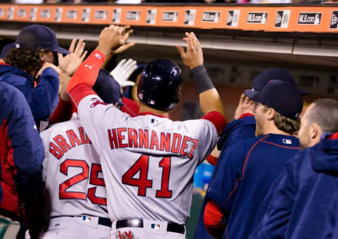 Jun 7, 2016; San Francisco, CA, USA; Boston Red Sox second baseman Marco Hernandez (41) celebrates with teammates in the dugout after scoring against the San Francisco Giants in the tenth inning at AT&T Park. Mandatory Credit: John Hefti-USA TODAY Sports