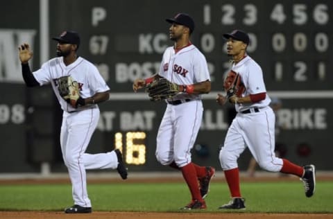 Aug 27, 2016; Boston, MA, USA; Boston Red Sox center fielder Jackie Bradley Jr. (25), left fielder Chris Young (30) and right fielder Mookie Betts (50) run off the field after defeating the Kansas City Royals at Fenway Park. Mandatory Credit: Bob DeChiara-USA TODAY Sports