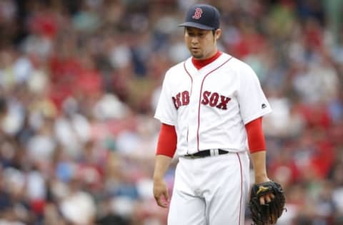 Aug 31, 2016; Boston, MA, USA; Boston Red Sox pitcher Junichi Tazawa (36) reacts after giving up two runs during the eighth inning against the Tampa Bay Rays at Fenway Park. Mandatory Credit: Greg M. Cooper-USA TODAY Sports