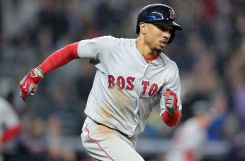 Sep 28, 2016; Bronx, NY, USA; Boston Red Sox right fielder Mookie Betts (50) runs to first base after hitting an two run double against the New York Yankees during the eighth inning at Yankee Stadium. Mandatory Credit: Brad Penner-USA TODAY Sports