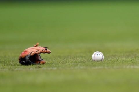 Oct 1, 2016; Philadelphia, PA, USA; A Baseball glove and ball rest on the field prior to a game between the Philadelphia Phillies and the New York Mets at Citizens Bank Park. Mandatory Credit: Derik Hamilton-USA TODAY Sports