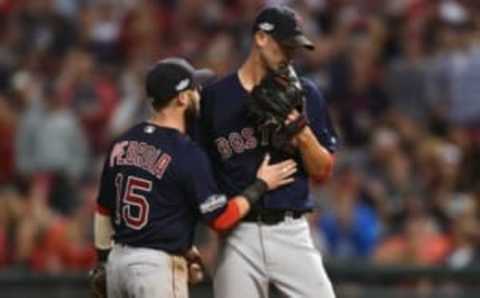 October 6, 2016; Cleveland, OH, USA; Boston Red Sox second baseman Dustin Pedroia (15) speaks with starting pitcher Rick Porcello (22) during game one of the 2016 ALDS playoff baseball game at Progressive Field. Mandatory Credit: Ken Blaze-USA TODAY Sports