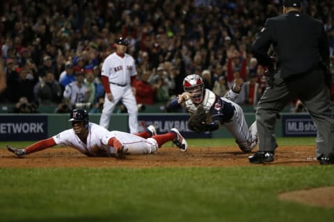 Oct 10, 2016; Boston, MA, USA; Boston Red Sox shortstop Xander Bogaerts (2) dives in safely ahead of the tag of Cleveland Indians catcher Roberto Perez (55) to score a run in the fifth inning during game three of the 2016 ALDS playoff baseball series at Fenway Park. Mandatory Credit: Greg M. Cooper-USA TODAY Sports