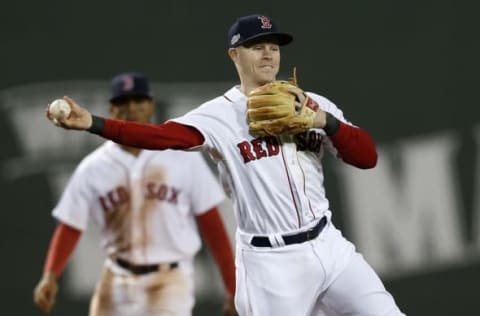 Oct 10, 2016; Boston, MA, USA; Boston Red Sox left fielder Brock Holt (12) throws to first for an out in the sixth inning against the Cleveland Indians during game three of the 2016 ALDS playoff baseball series at Fenway Park. Mandatory Credit: Greg M. Cooper-USA TODAY Sports