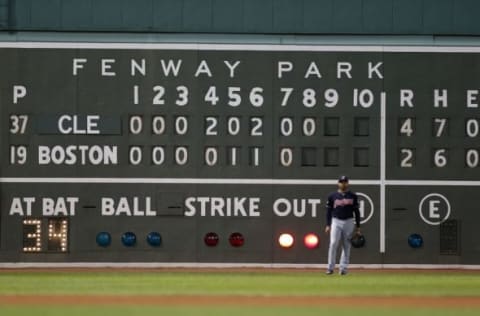 Oct 10, 2016; Boston, MA, USA; Cleveland Indians left fielder Coco Crisp (4) stands infant of the scoreboard in left field during the eighth inning of game three of the 2016 ALDS playoff baseball series against the Boston Red Sox at Fenway Park. Mandatory Credit: Greg M. Cooper-USA TODAY Sports