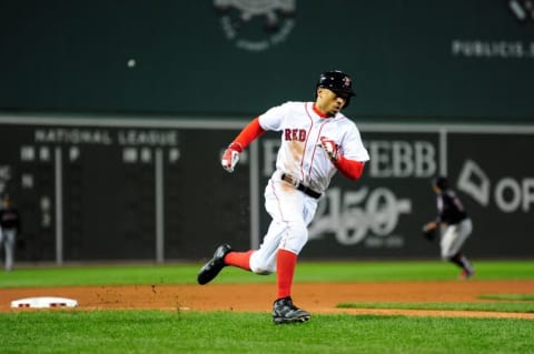 Oct 10, 2016; Boston, MA, USA; Boston Red Sox right fielder Mookie Betts (50) rounds third base to score a run in the eighth inning against the Cleveland Indians during game three of the 2016 ALDS playoff baseball series at Fenway Park. Mandatory Credit: Bob DeChiara-USA TODAY Sports