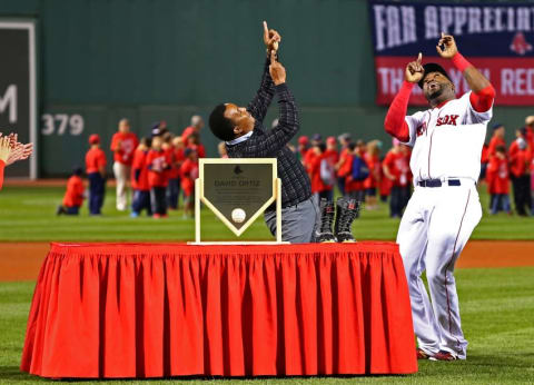 Sep 21, 2015; Boston, MA, USA; Boston Red Sox designated hitter David Ortiz (R) and former pitcher Pedro Martinez celebrate during a pregame ceremony to honor Ortiz