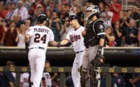 Sep 1, 2016; Minneapolis, MN, USA; Minnesota Twins third baseman Trevor Plouffe (24) first baseman Joe Mauer (7) celebrate at Target Field. Mandatory Credit: Jordan Johnson-USA TODAY Sports