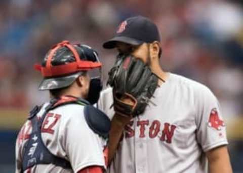 Sep 25, 2016; St. Petersburg, FL, USA; Boston Red Sox starting pitcher Eduardo Rodriguez (52) and catcher Christian Vazquez (7) talk on the mound against the Tampa Bay Rays at Tropicana Field. Mandatory Credit: Jeff Griffith-USA TODAY Sports