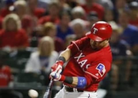 Sep 30, 2016; Arlington, TX, USA; Texas Rangers designated hitter Carlos Beltran (36) hits a home run in the third inning against the Tampa Bay Rays at Globe Life Park in Arlington. Mandatory Credit: Tim Heitman-USA TODAY Sports