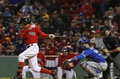 Sep 30, 2016; Boston, MA, USA; Boston Red Sox right fielder Mookie Betts (50) hits an RBI single against the Toronto Blue Jays in the seventh inning at Fenway Park. Mandatory Credit: David Butler II-USA TODAY Sports