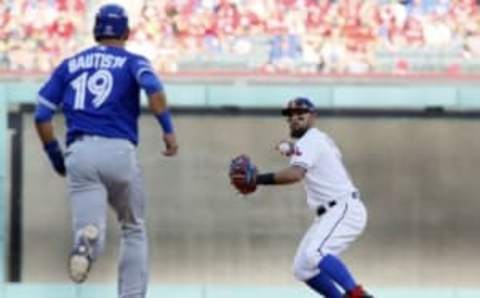 October 6, 2016; Arlington, TX, USA; Texas Rangers second baseman Rougned Odor (12) throws to second for the double play as Toronto Blue Jays right fielder Jose Bautista (19) runs to second in the seventh inning at Globe Life Park in Arlington. Mandatory Credit: Tim Heitman-USA TODAY Sports