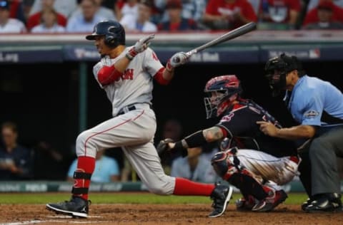 Oct 7, 2016; Cleveland, OH, USA; Boston Red Sox right fielder Mookie Betts (50) hits a single against the Cleveland Indians in the sixth inning during game two of the 2016 ALDS playoff baseball series at Progressive Field. Mandatory Credit: Rick Osentoski-USA TODAY Sports