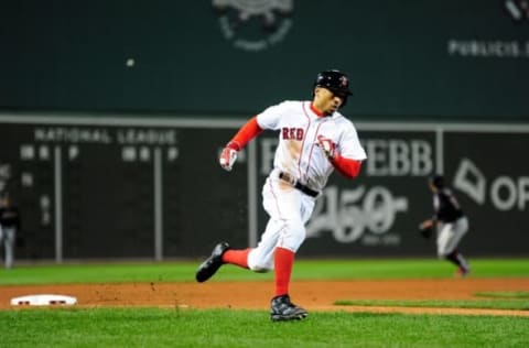 Oct 10, 2016; Boston, MA, USA; Boston Red Sox right fielder Mookie Betts (50) rounds third base to score a run in the eighth inning against the Cleveland Indians during game three of the 2016 ALDS playoff baseball series at Fenway Park. Mandatory Credit: Bob DeChiara-USA TODAY Sports