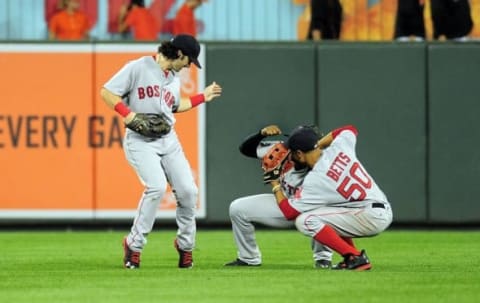 Sep 21, 2016; Baltimore, MD, USA; Boston Red Sox outfielders Andrew Benintendi (left), Jackie Bradley, Jr. (center) and Mookie Betts (right) celebrate after beating the Baltimore Orioles 5-1 at Oriole Park at Camden Yards. Mandatory Credit: Evan Habeeb-USA TODAY Sports