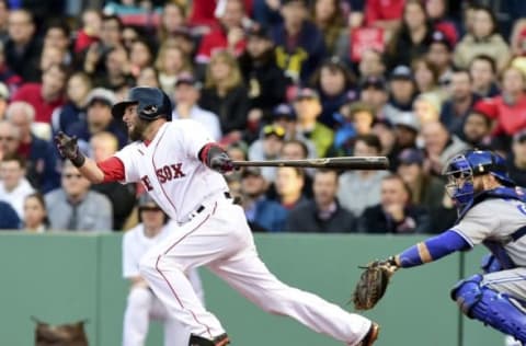 Apr 28, 2015; Boston, MA, USA; Boston Red Sox second baseman Dustin Pedroia (15) hits an RBI single during the second inning against the Toronto Blue Jays at Fenway Park. Mandatory Credit: Bob DeChiara-USA TODAY Sports